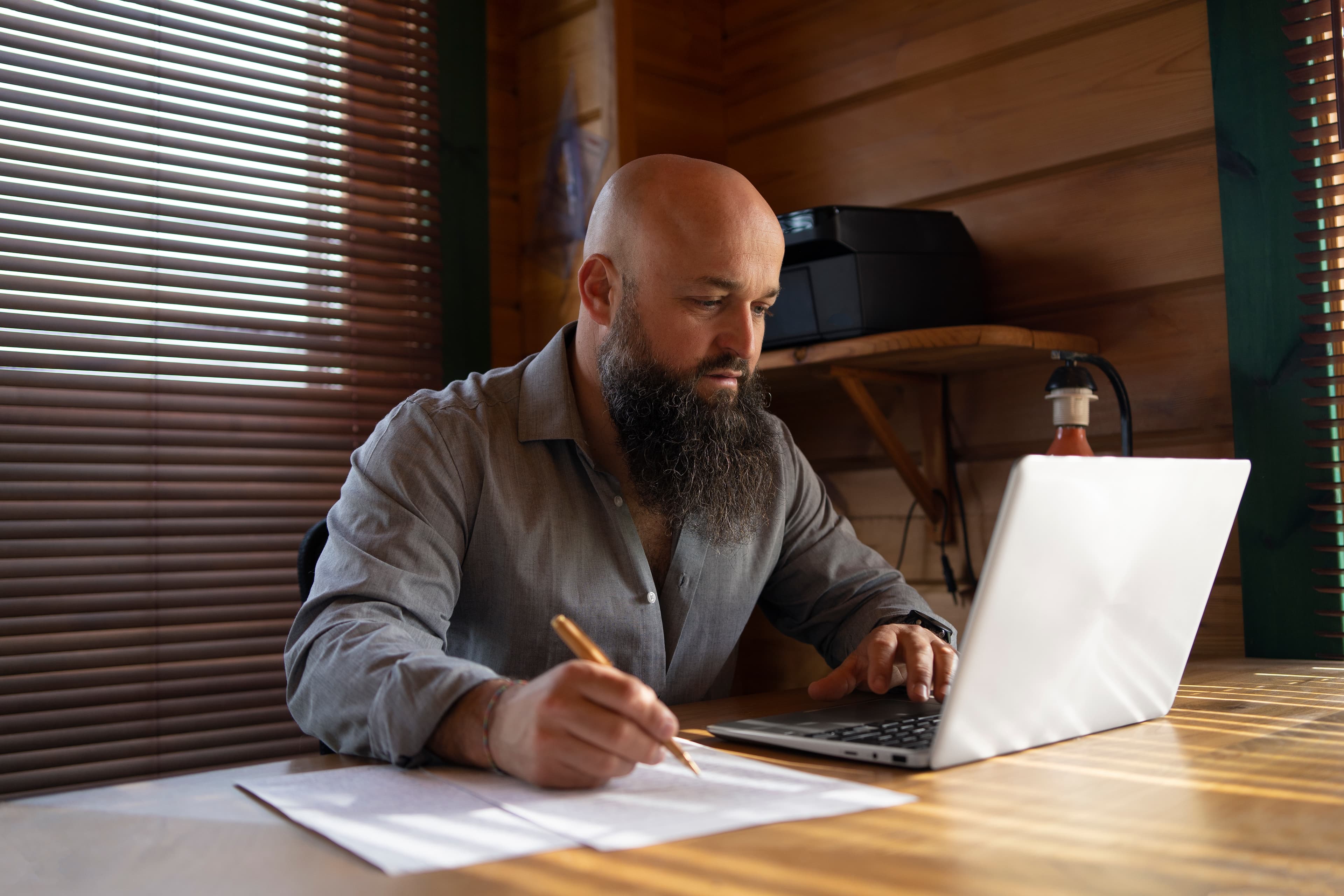 Shortlet owner reviewing weekly bookings and expenses in a notebook