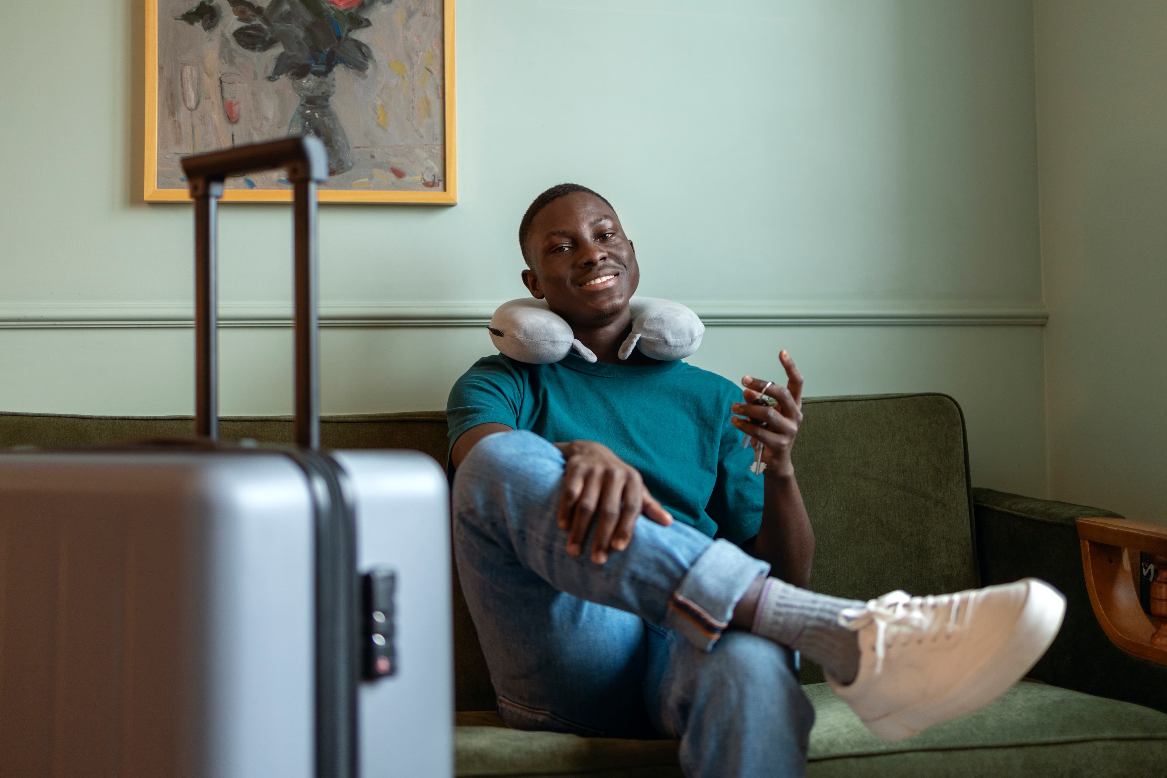 Guest reviewing a shortlet booking confirmation on a phone before check-in in Nigeria